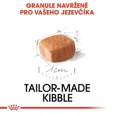 Granule navržené pro vašeho jezevčíka, zobrazen jeden kus s popisem 1 cm. Text: TAILOR-MADE KIBBLE.