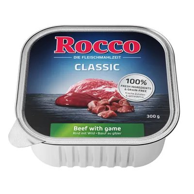 Embalagem de comida húmida Rocco Classic, 300 g, texto visível: '100% fresh ingredients & grain-free', 'Beef with game', 'Rind mit Wild', 'Bœuf au gibier'.