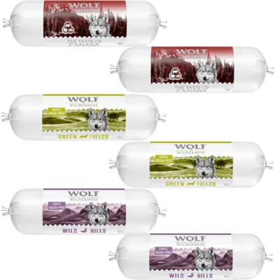 Flere pølser med mærket WOLF Wilderness, varianter: THE TASTE OF CANADA, GREEN FIELDS og WILD HILLS. Tekst: 100% grain-free. Hver pølse indeholder 400 g.
