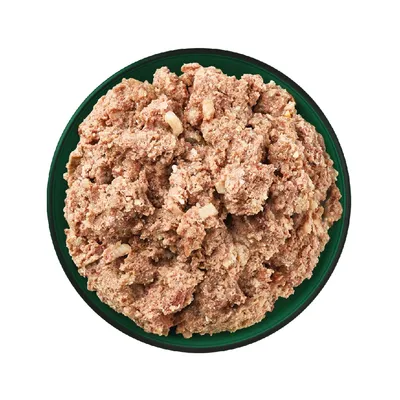 Bowl filled with moist, chunky pet food in a minced texture, shown from above to display consistency and ingredients.