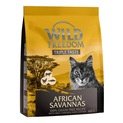 Wild Freedom Triple Taste African Savannas, 100% brez žit receptura z govedino, piščancem in somom, 400 g. Embalaža prikazuje mačko in afriško pokrajino.