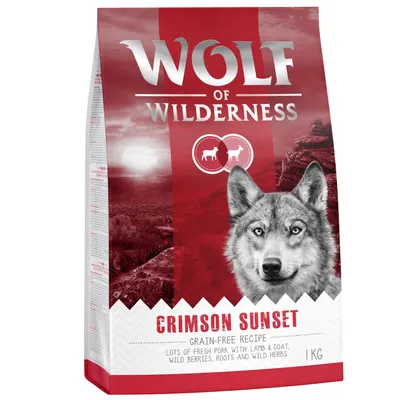 Confezione Wolf of Wilderness Crimson Sunset, ricetta senza cereali, 1 kg. Testo visibile: lots of fresh pork with lamb & goat, wild berries, roots and wild herbs.
