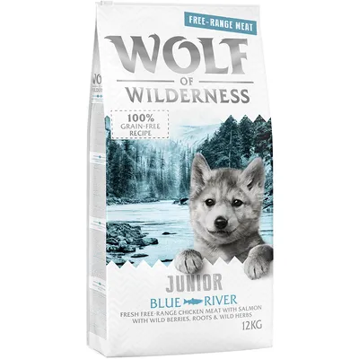 Wolf of Wilderness Junior Blue River, 12 kg. Receptura s volně chovaným kuřetem a lososem, lesními plody, kořeny a bylinkami. 100% bez obilovin.