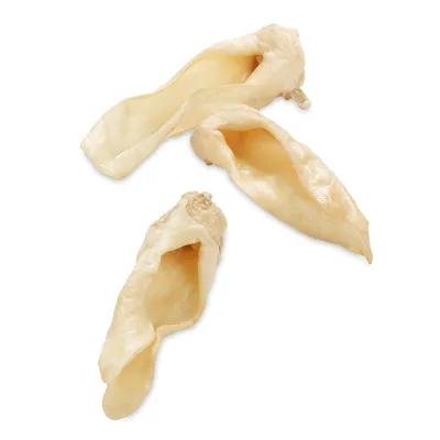 Three dried pig ears, natural and without visible additives.