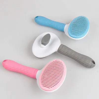 Pawzy Brosse à toilettage pour chats : Bouton anti-poils Pawzy Brosse à toilettage pour chats : Bouton anti-poils
