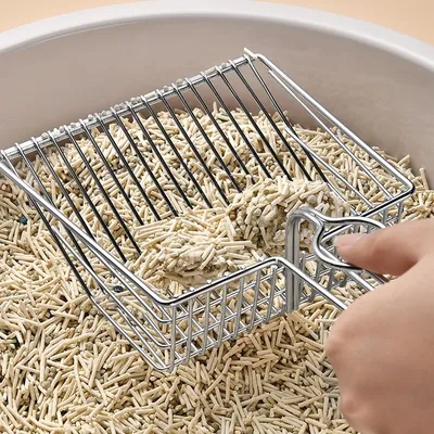 Pelle à litière en métal