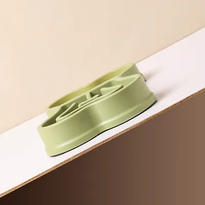 Bol distributeur de nourriture lente à double usage en forme d'os